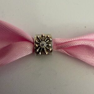 Pandora Silver Floral Burst Bead Charm on Pink Ribbon
